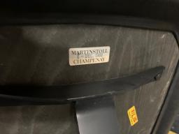 Photo détaillant le don chaise vintage MARTINSTOLL à roulettes